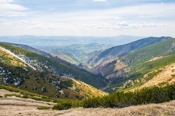 Views from Dumbier Mountain in Low Tatras mountains. Late spring, snow-capped mountains. Tourism and hiking NAPANT National Park travel destination