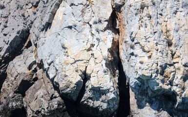 Stone rock in the mountains as an abstract background.