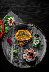 sushi roll with salmon and rice in plate