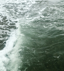 Wave in the sea with splashing water.