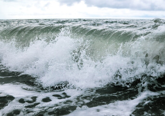Wave in the sea with splashing water.