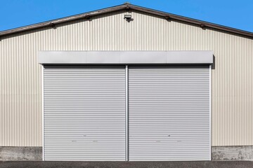 Fototapeta na wymiar A white shutter door close at an industrial warehouse