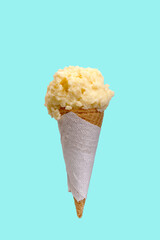 Vanilla ice cream served in a waffle cone.