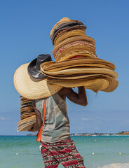 Hat seller on a Jamaican beach.