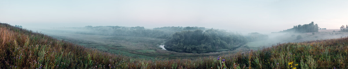 Fototapeta premium Panoramic view of foggy hills
