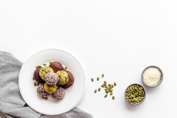 Granola raw energy balls on a plate, top view