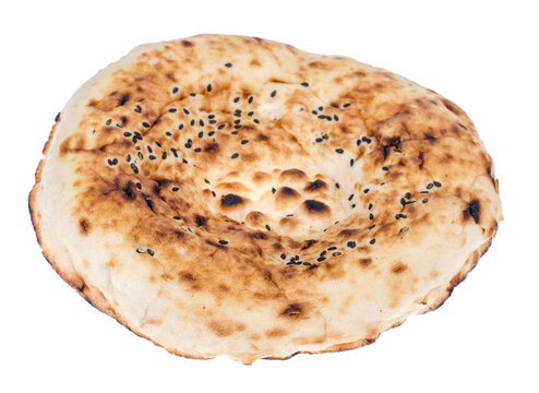 Tandoor flatbread with sesame seeds on white background