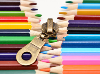 Colored zipper made of wooden pencils, concept self-extracting archive © Dmitry