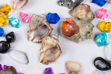 Bright background of their colored stones and seashells.