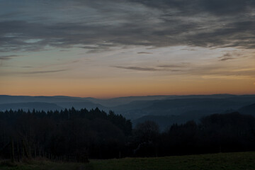 uplands sunset sun below horizon trees and meadow
