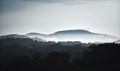 Abstract silhouette mountain anf foggy in morning background