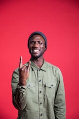 Young Black Man Showing the Rock and Roll Hand Sign