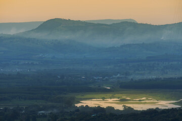Fototapeta premium Morning mist in the middle of the valley