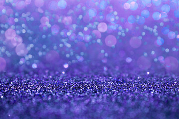 Selective focus in the middle for your product. Purple glitter abstract background with defocus lights. Violet sparkle glitter abstract background. Circle, abstraction.