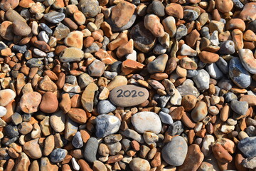 UK holiday accommodation features huts cottages and hotels for a coastal staycation which is at high demand this year Hastings lifeguarded beach in summertime is mostly made up of sea smoothed pebbles