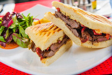 Toasts with red salmon served with french fries and salad