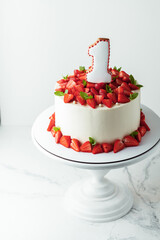 First birthday cake on the white cake stand