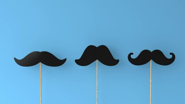 moustaches on a blue background. Father's day or mens health concept