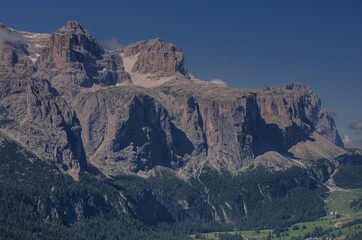 View of the north side of Sella mountain group, plateau-shaped massif with Gardena pass in background, from Piz La Ila mountain, Val Badia, La Villa village, Dolomites, Alta Badia, South Tirol, Italy.