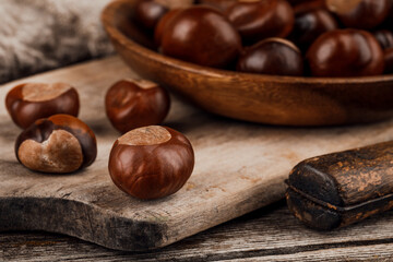 Chestnuts on an old wooden table