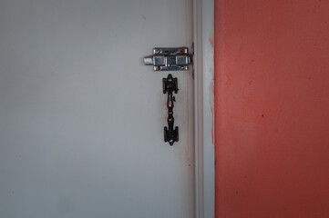 Steel door knob and latch on the pvc door