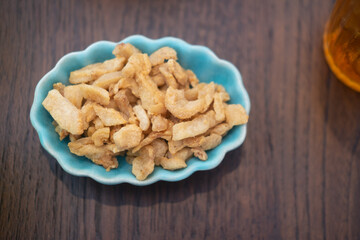 Crispy pork crackling in ceramic cup. Thai food