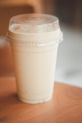 Close up milk coffee smoothie in plastic cup