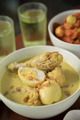 Closeup of chicken braised in coconut milk is Indonesian traditional food, called Opor Ayam. Signature dish for Eid Holiday.