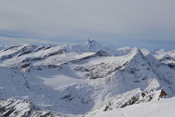Fototapeta na wymiar Mountain peaks in the snow