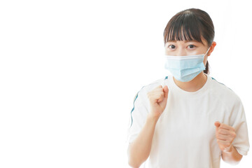 マスクをつけてランニングをする若い学生