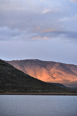 Fototapeta na wymiar Late afternoon sun reflecting off a rocky hill in the Karoo in South Africa