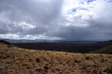Isolated rain shower in the arid semi-desert Karoo landscape in South Africa