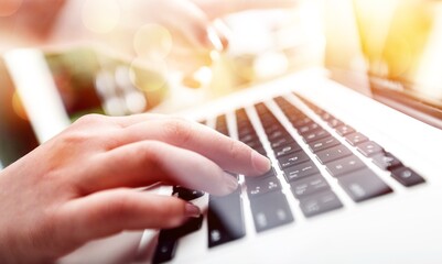 Woman typing computer.
