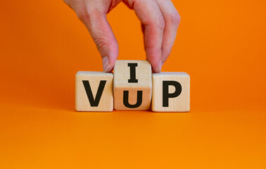 Hand turns a cube and changes the acronym 'VUP' - very unimportant person to 'VIP' - very important...