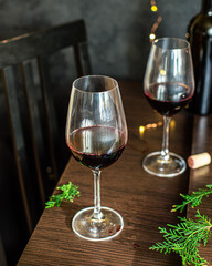 red wine in a glass festive table setting christmas holidays party new year meal on the table tasty serving size portion top view copy space for text food background rustic