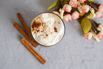 Glass of yogurt with cinnamon and caramel. Tasty sweet dessert.