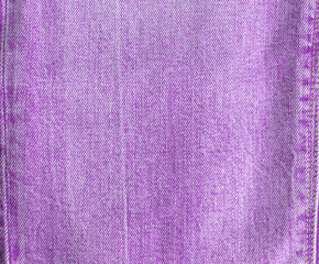 Texture of purple jeans. Denim. View from above.