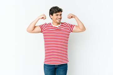 Young cool man showing strength gesture with arms, symbol of feminine power