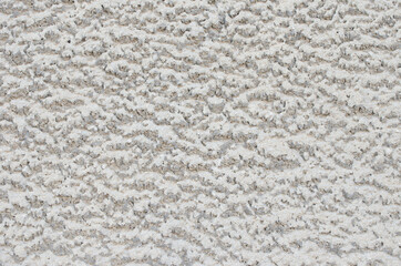 Decorative stucco wall of the house.