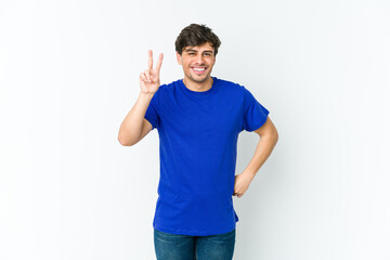 Fototapeta premium Young cool man showing number two with fingers.