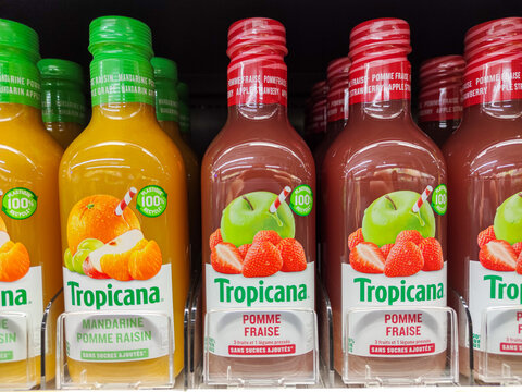 Row Of Tropicana Various Squeezed Fruit Juices Bottles On Shelves In A French Supermarket