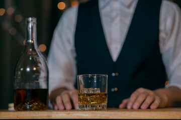 Barman pouring whiskey whiskey glass beautiful night