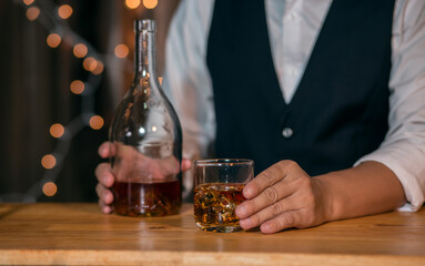 Barman pouring whiskey whiskey glass beautiful night