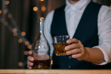 Barman pouring whiskey whiskey glass beautiful night