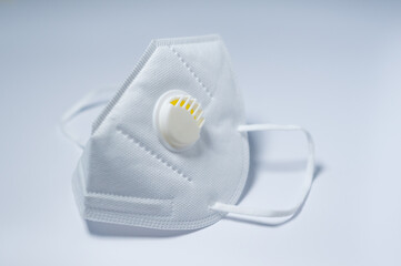 Respirator with exhalation valve isolated on a white background