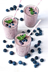 Berry and mint smoothie  - healthy breakfast on wooden table