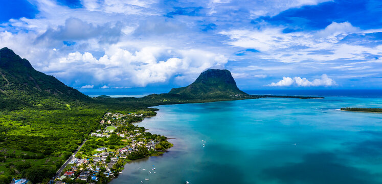 Mauritius, Black River, Tamarin, Helicopter view of coastal village with Le Morne Brabant mountain in background