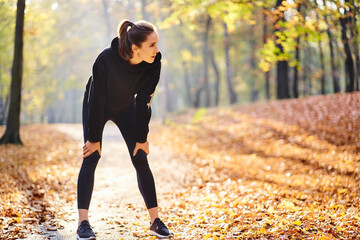 Young woman during break in autumn forest