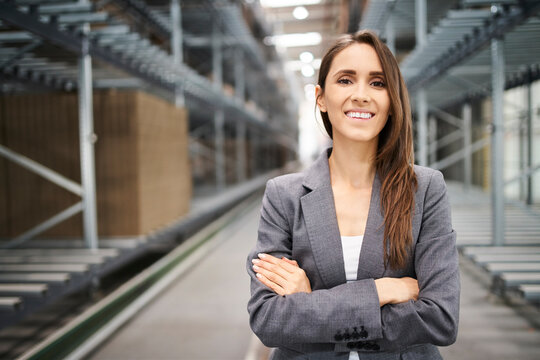 Portrait of smiling businesswoman in a factory