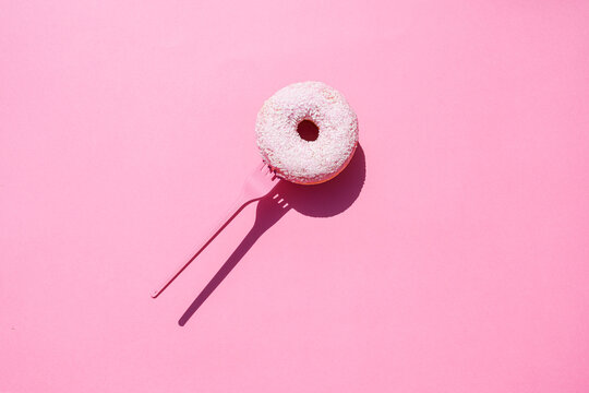 Studio shot of&Ocirc;&oslash;&Omega;fork with sweet doughnut